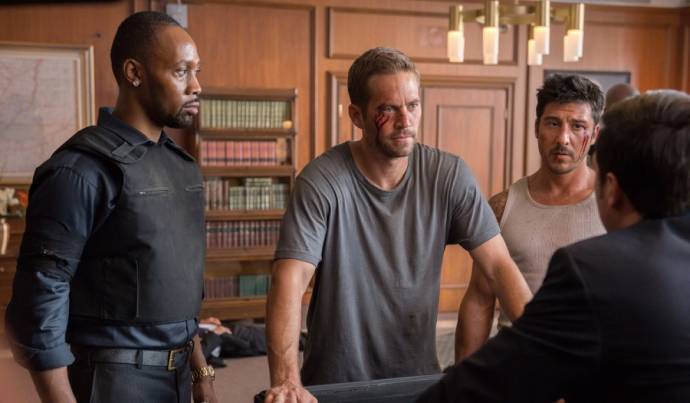 RZA (Tremaine), Paul Walker (Damien) en David Belle (Lino) in Brick Mansions