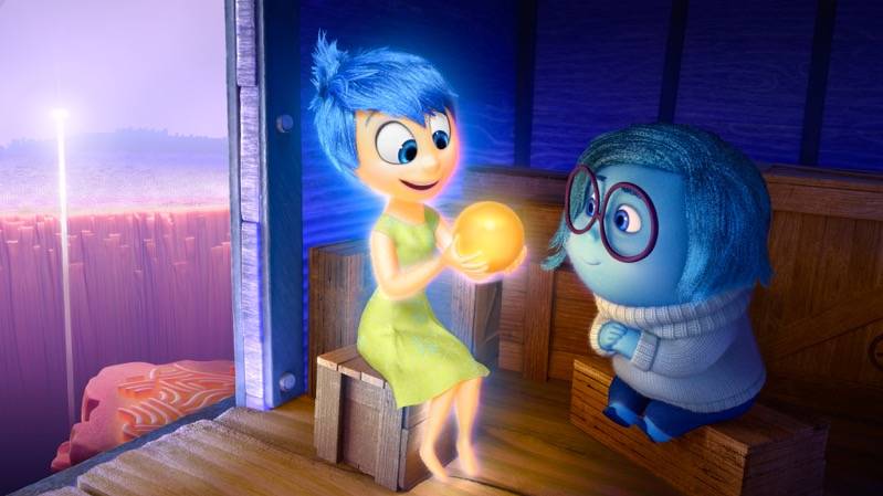 Joy (voice of Amy Poehler) and Sadness (voice of Phyllis Smith) catch a ride on the Train of Thought in Disney?Pixar's